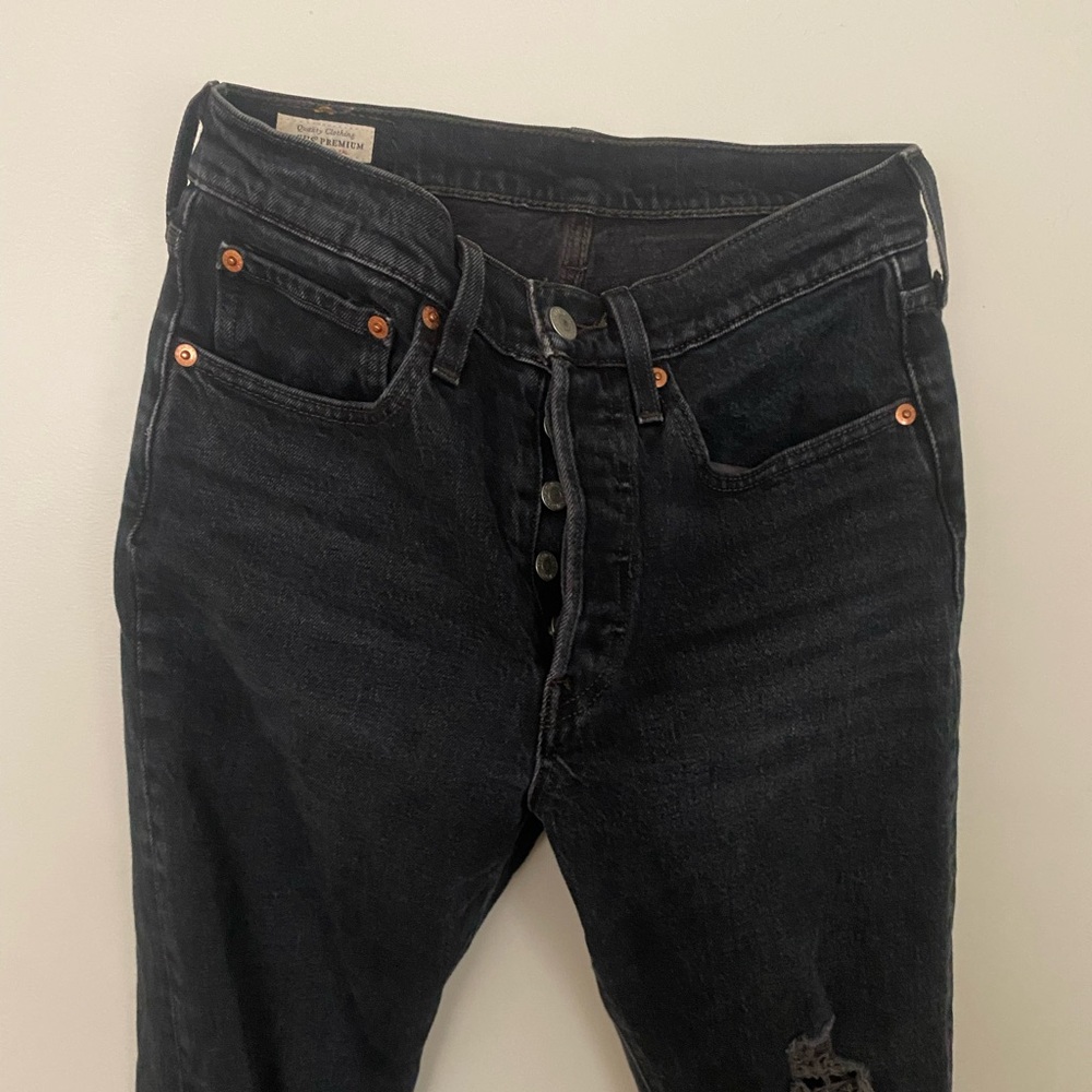 Distressed Black Levi’s 501s
